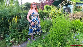 Play Busty babe Red XXX fingers herself in the garden